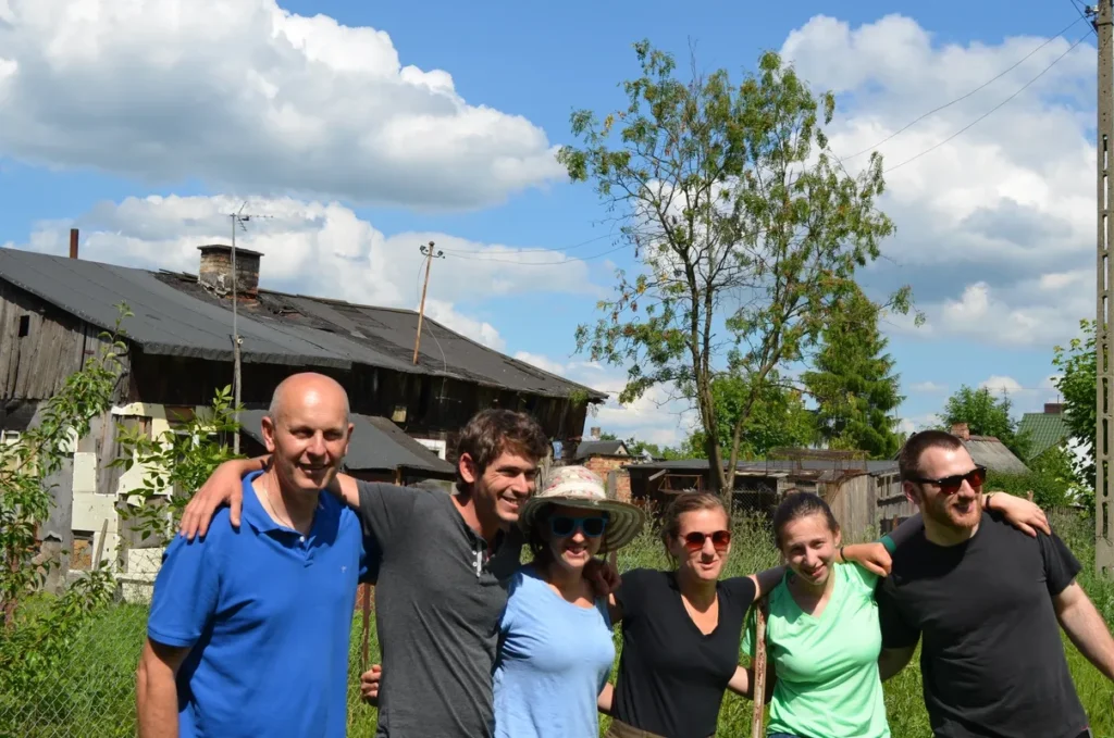 Grzegorz, Micha, Shoshana, Elisheva, Esther and Jack standing in the place of the Kwiatek Soda Factory.