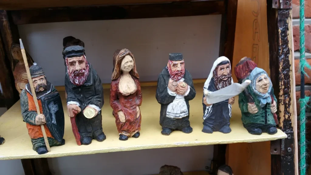 Some of the wooden Jewish figures of Jews one can buy at tourists shops in Poland.   They are good luck charmes.